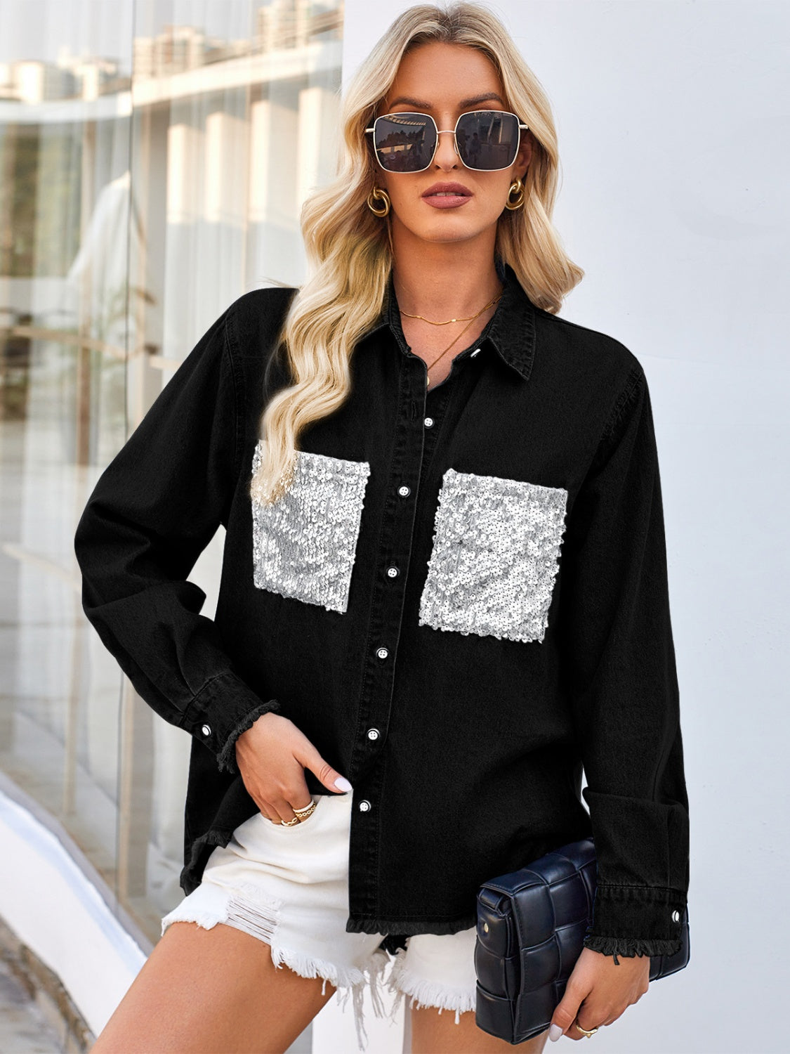 Black denim shirt with sequin embellished pockets and frayed cuffs.