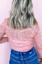 Rose lace second-skin top in dusty pink with floral pattern and long sleeves.