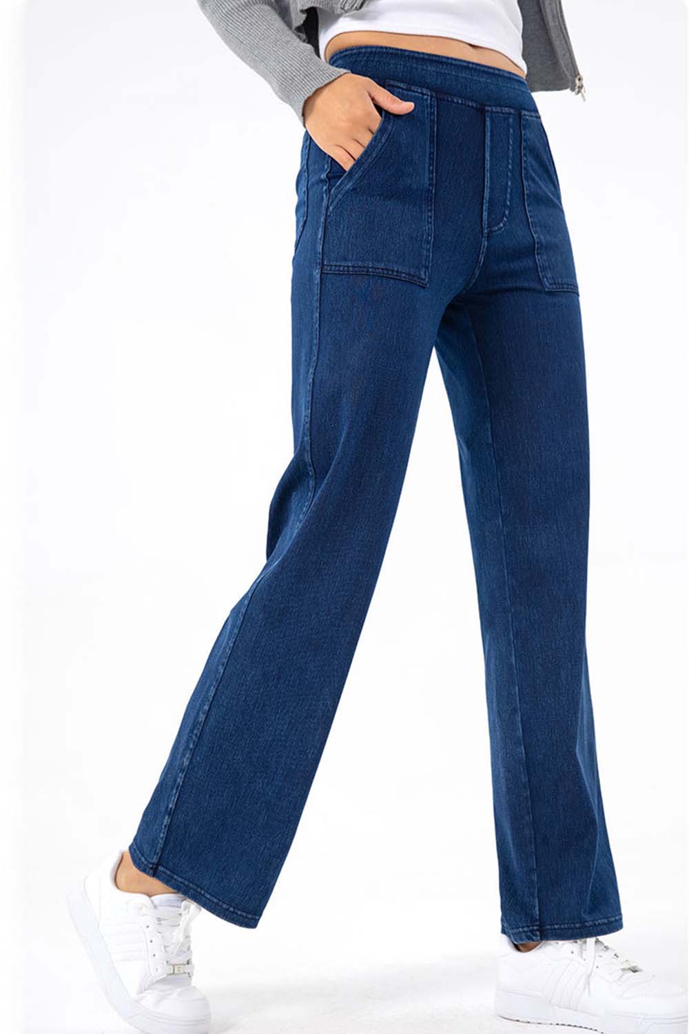 Dark wash denim jeans with utility pockets and a straight leg cut.
