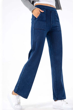 Dark wash denim jeans with utility pockets and a straight leg cut.