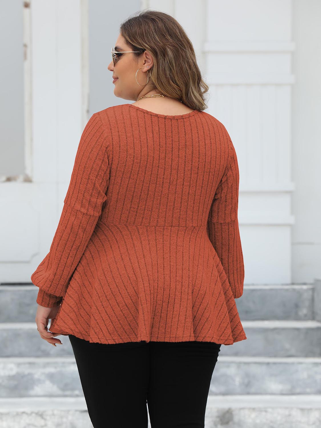 Ribbed peplum blouse in Red Orange with blouson sleeves.