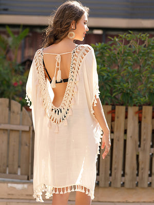 White crochet back tassel trim cover-up with a deep V-neck and tie closure.