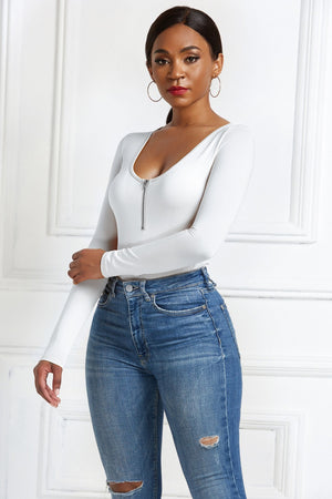 White long sleeve bodysuit with plunge neckline and zip front detail.
