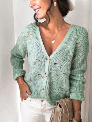 Light green scalloped knit button-down cardigan with a V-neck and textured pattern.