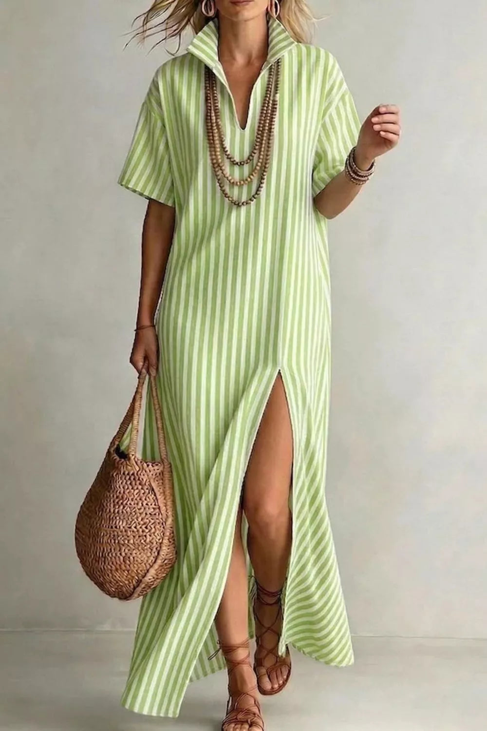 Lime striped V-neck maxi dress with short sleeves and a high slit.
