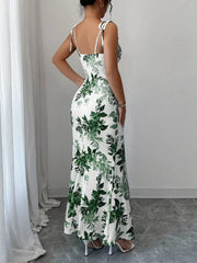 Floral print maxi dress with tie straps and a fitted silhouette.