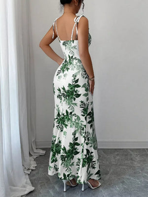 Floral print maxi dress with tie straps and a fitted silhouette.