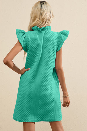 Turquoise textured trapeze dress with ruffle sleeves and a high ruffled neckline.