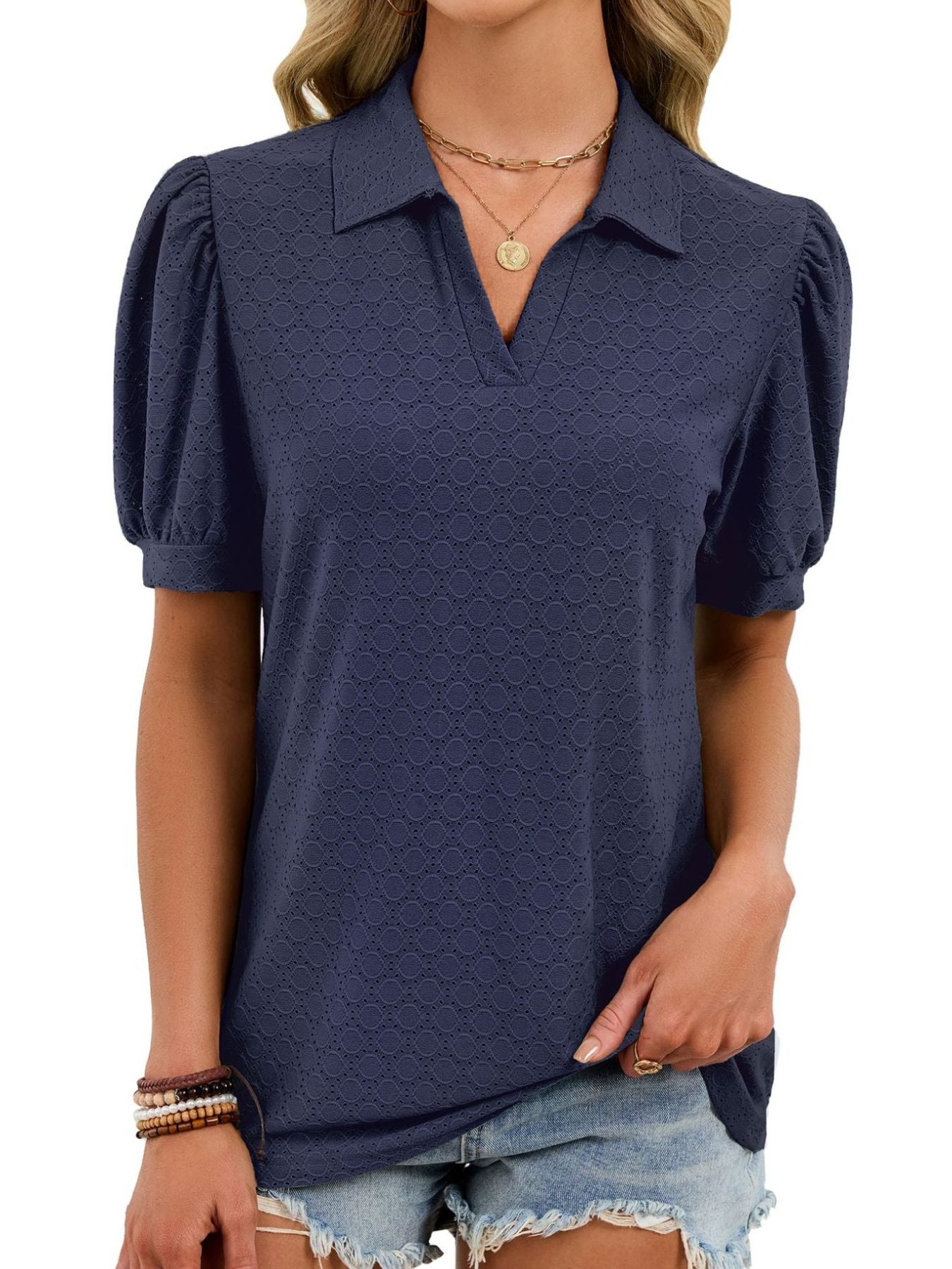 Navy blue eyelet collar top with puff sleeves and v-neck