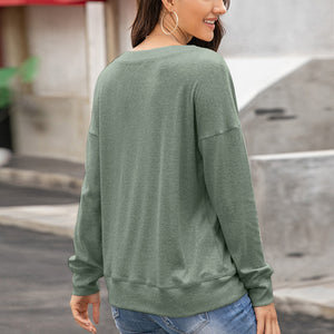 Henley-inspired drop shoulder sweatshirt in Matcha Green with crewneck and long sleeves.