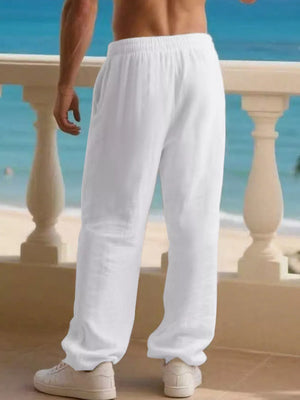 Men's white linen drawstring joggers with a relaxed fit.