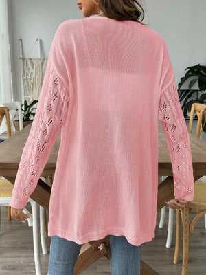 Pink openwork diamond knit duster cardigan with long sleeves and a relaxed fit.