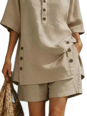 Khaki linen shorts with button detail, part of a relaxed two-piece ensemble.