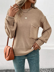 Camel knit sweater with raglan sleeves, crewneck, and a front pocket detail.