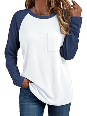 White and dark blue raglan long sleeve t-shirt with round neck and chest pocket.