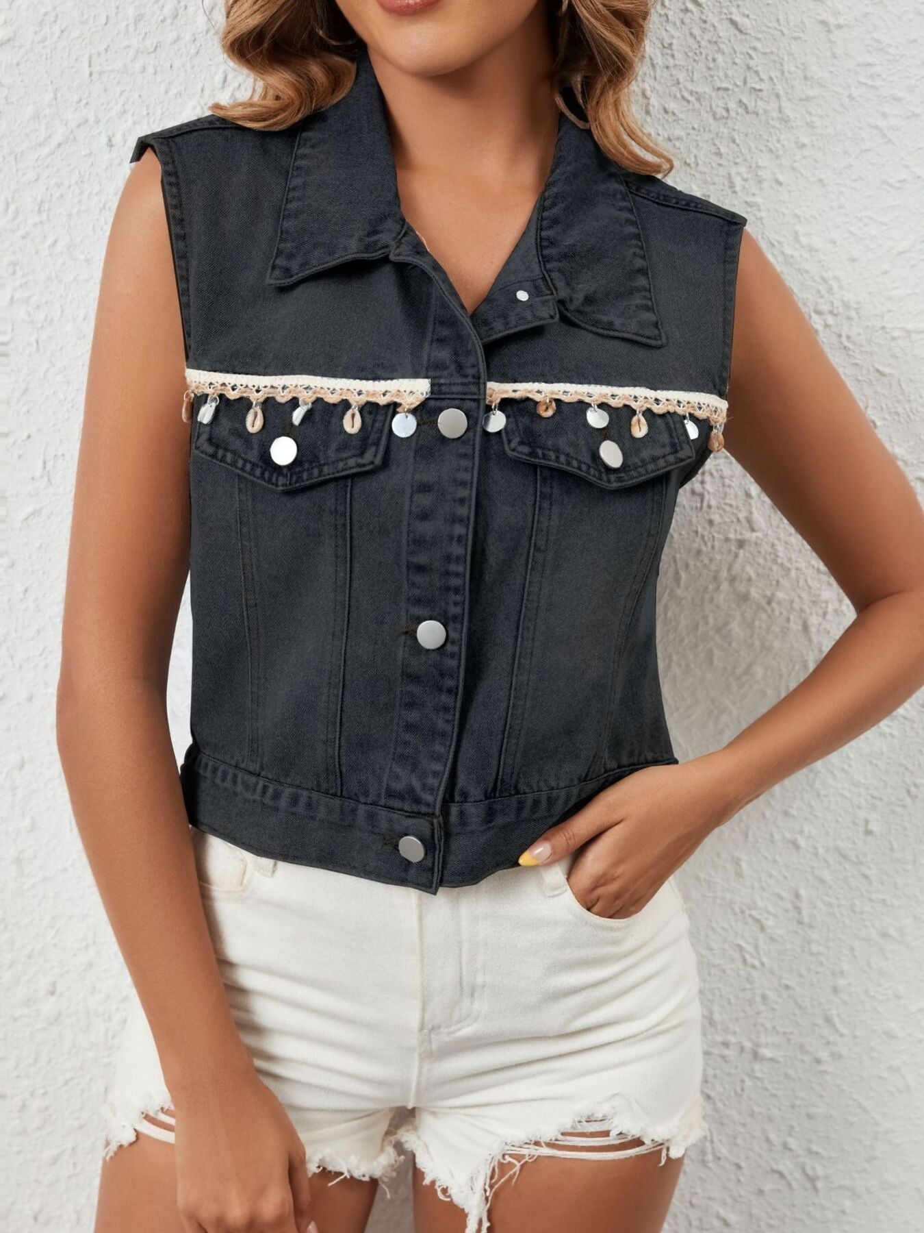 Black denim button-up vest with shell and sequin trim and chest pockets