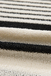 Textured black and white striped knit sleeveless top with a loose weave.