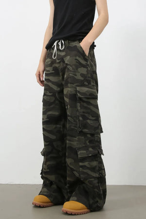 Wide-leg camo cargo pants with drawstring waist and multiple pockets.