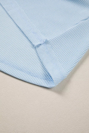 Light blue waffle knit t-shirt with curved hem detail