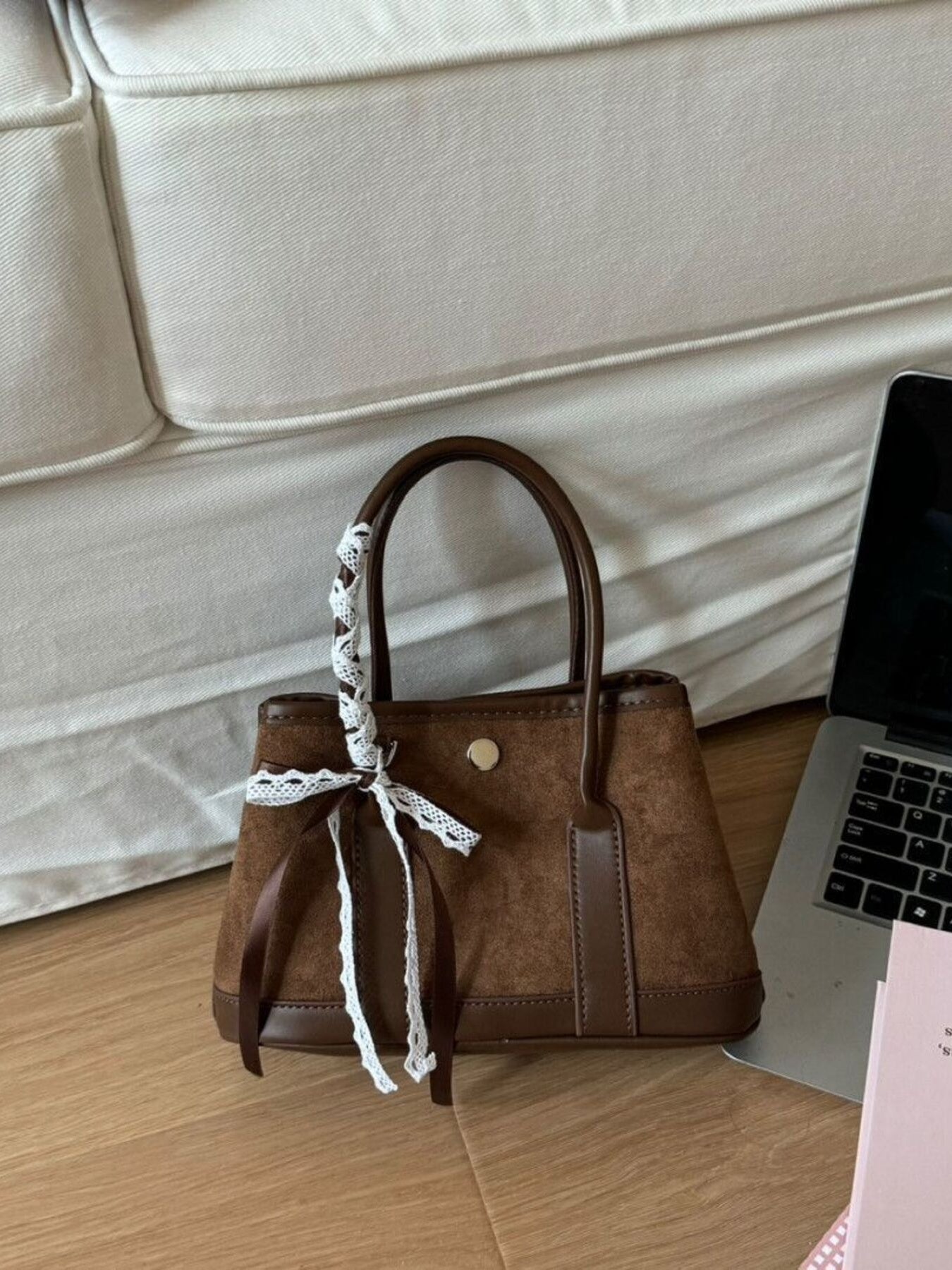 Brown suede tote bag with lace trim and ribbon detail