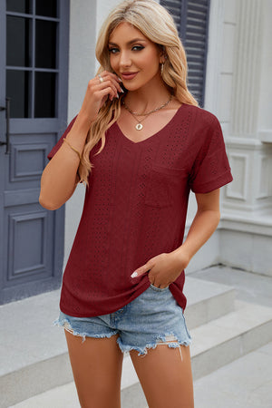 Burgundy perforated v-neck t-shirt with rolled sleeves and chest pocket.