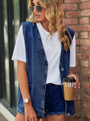 Oversized denim vest in medium blue with button front and patch pockets.