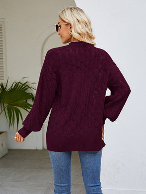 Wine open-knit balloon sleeve cardigan with textured pattern and ribbed trim.