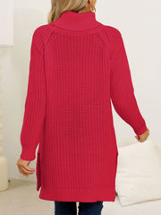 Scarlet knit turtleneck sweater with asymmetric hem and side slits.