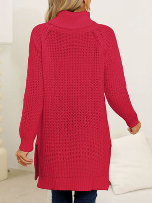 Scarlet knit turtleneck sweater with asymmetric hem and side slits.