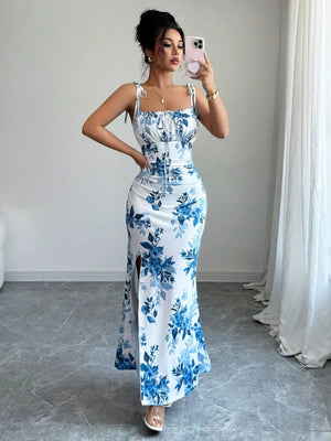 Floral print maxi dress in Peacock Blue with tie straps, square neckline, and thigh-high slits.