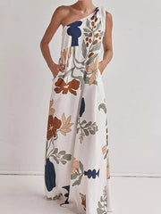 White one-shoulder maxi dress with floral print and pockets