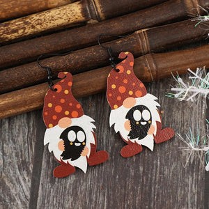 Spotted gnome wood dangle earrings in deep red with orange polka dots and ghost faces.