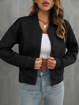 Black diamond quilted bomber jacket with zip front and ribbed cuffs.
