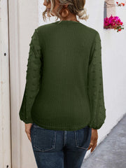 Army green waffle knit blouse with swiss dot sleeves and tie front detail.