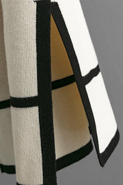 Cream acrylic loungewear set with black trim and plaid pattern detail.