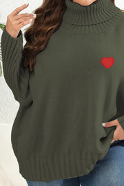 Army green turtleneck knit sweater with red heart appliqué and ribbed sleeves.