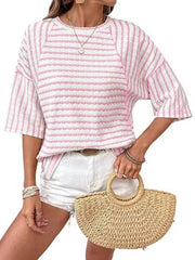 Pink and white wavy stripe knit t-shirt with relaxed fit and short sleeves.