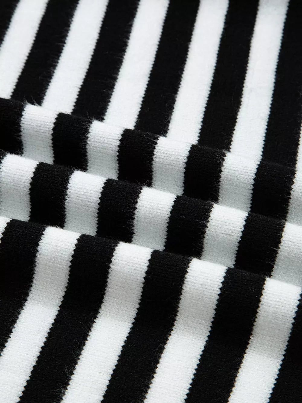 Colorblock striped knit sweater with crew neck and soft texture.