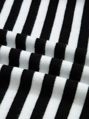 Colorblock striped knit sweater with crew neck and soft texture.