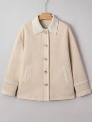 Lined western jacket in eggshell with sherpa collar, button front, and patch pockets.
