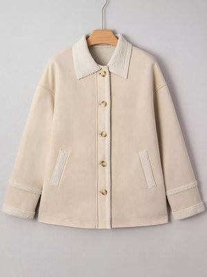 Lined western jacket in eggshell with sherpa collar, button front, and patch pockets.