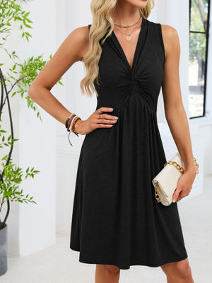 Black sleeveless casual dress with twist knot front and A-line skirt.
