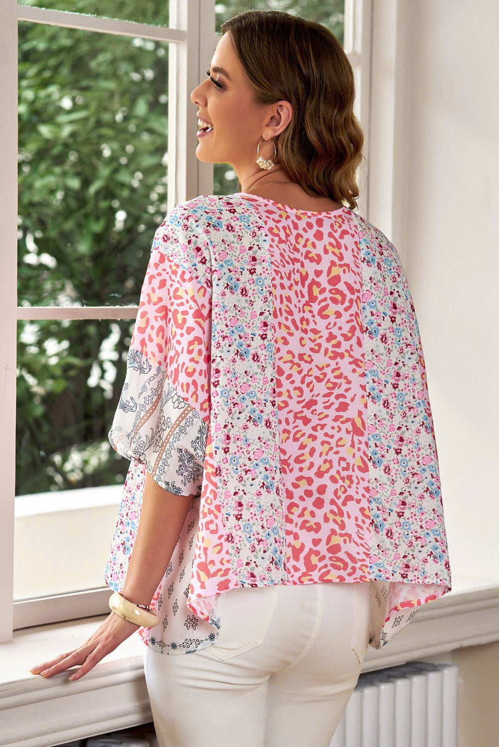 Panel print kimono sleeve blouse in floral with leopard and floral patterns.
