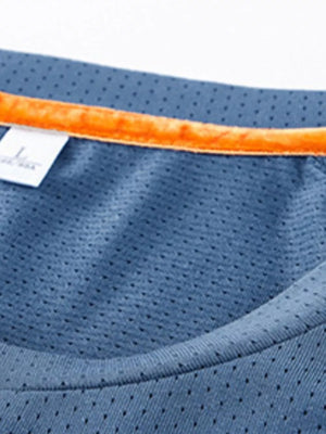 Men's French blue quick-dry active t-shirt with orange neck trim and mesh fabric detail.