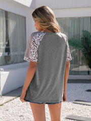 Gray raglan tee with leopard print sleeves and V-neck