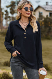 Dark blue textured polo-neck sweater with button detail and long sleeves.