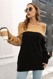 Asymmetric colorblock off-shoulder sweater in black and camel acrylic.