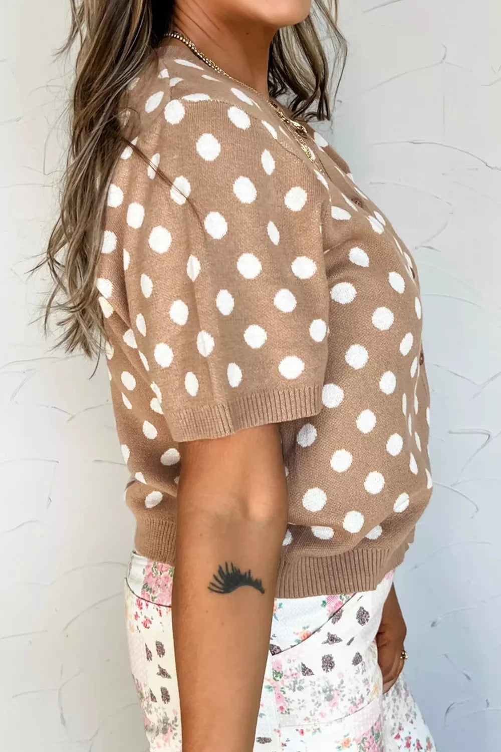 Camel polka dot short sleeve button-down cardigan with ribbed cuffs.