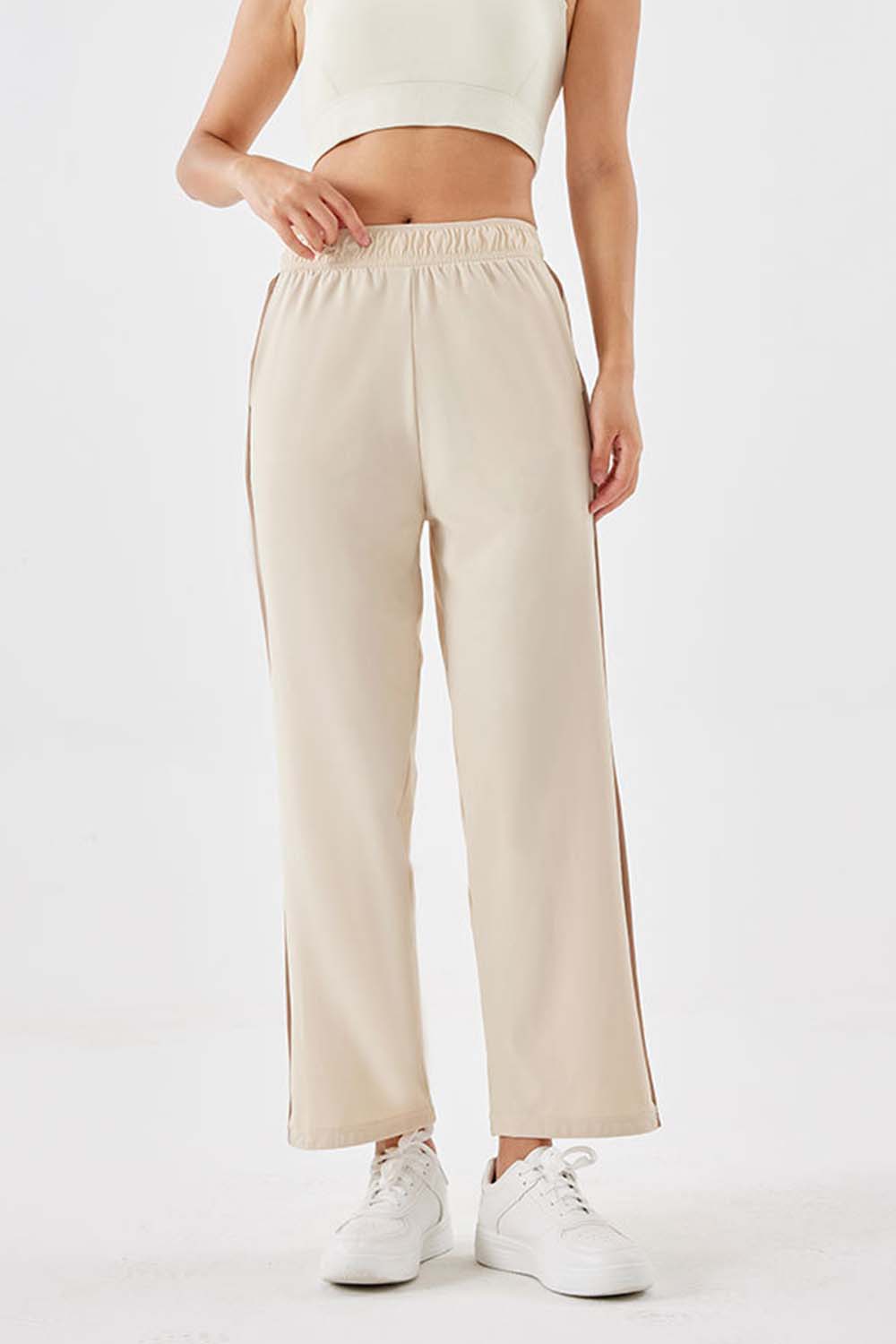 Side stripe relaxed trousers in camel with a comfortable elastic waistband and wide leg.