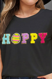 Black t-shirt with sequin "Hoppy" graphic and Easter egg detail.